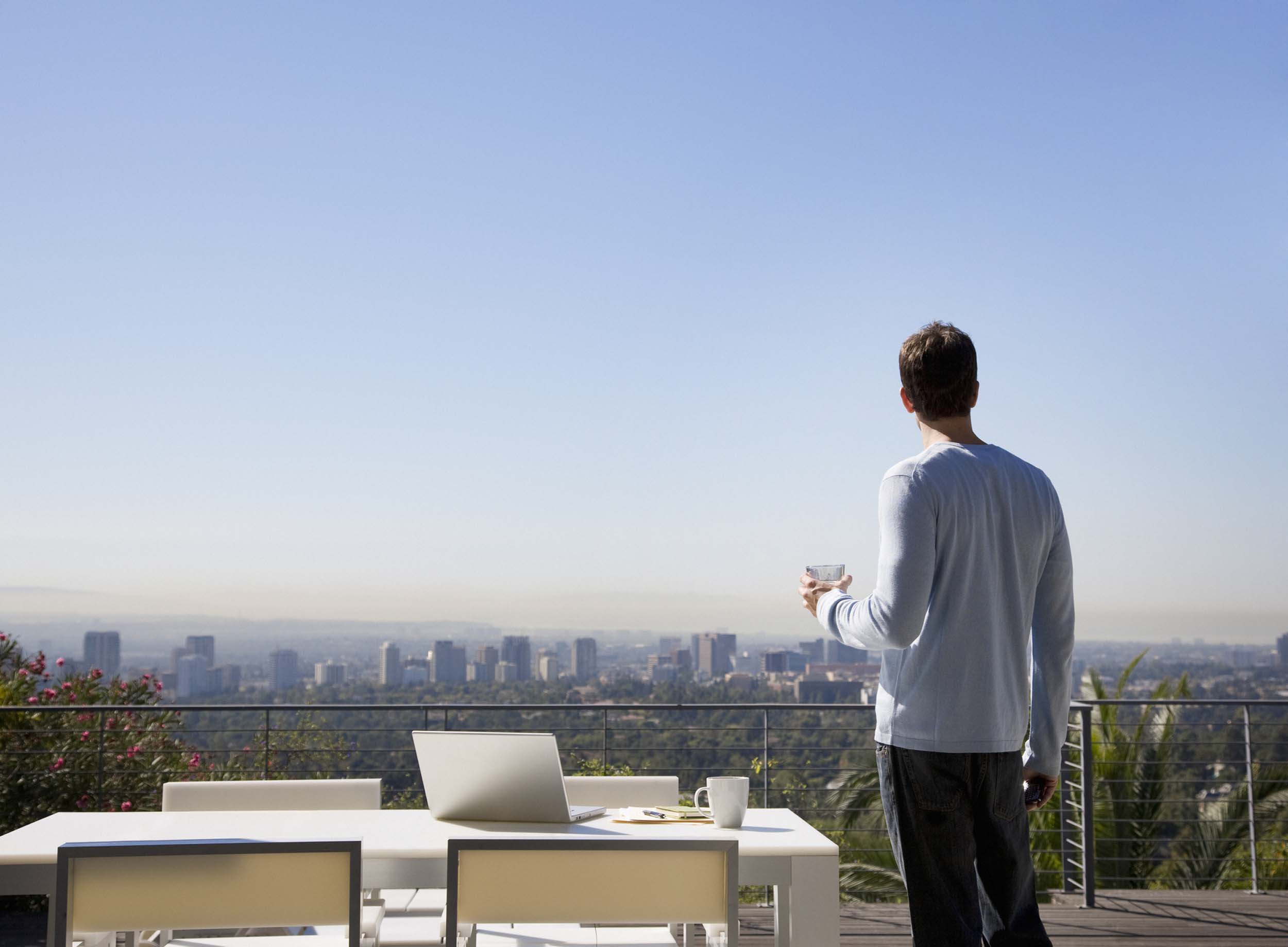 Man looking at a city skyline.