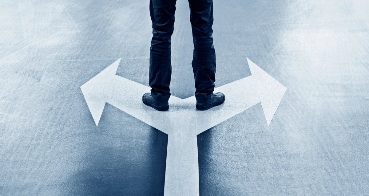 Man standing on arrows.