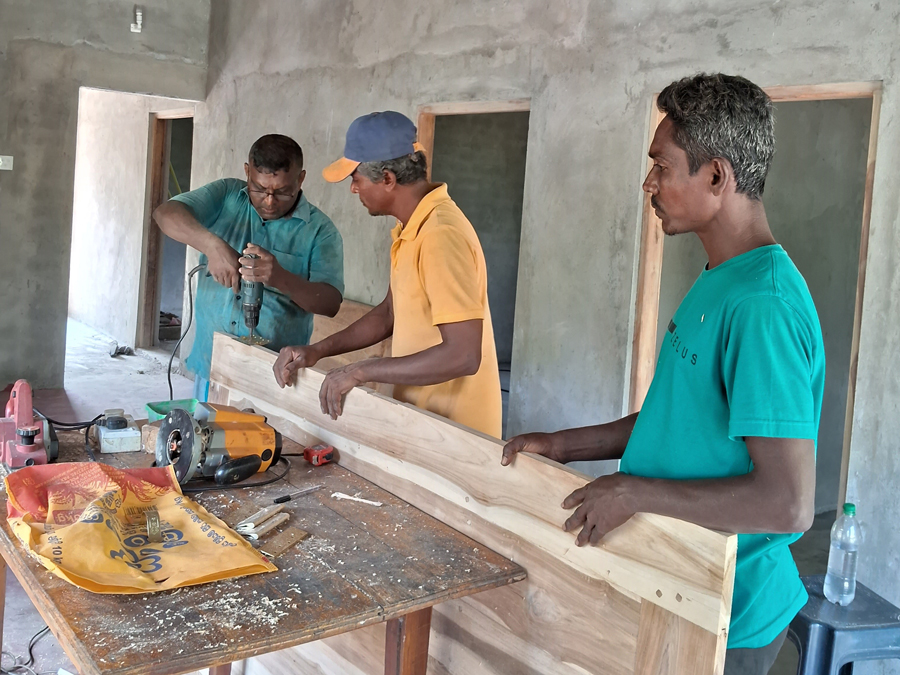 Workers building a house.