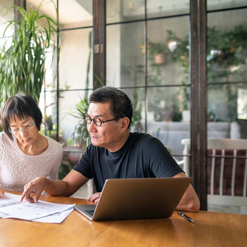 Couple reviewing paperwork.