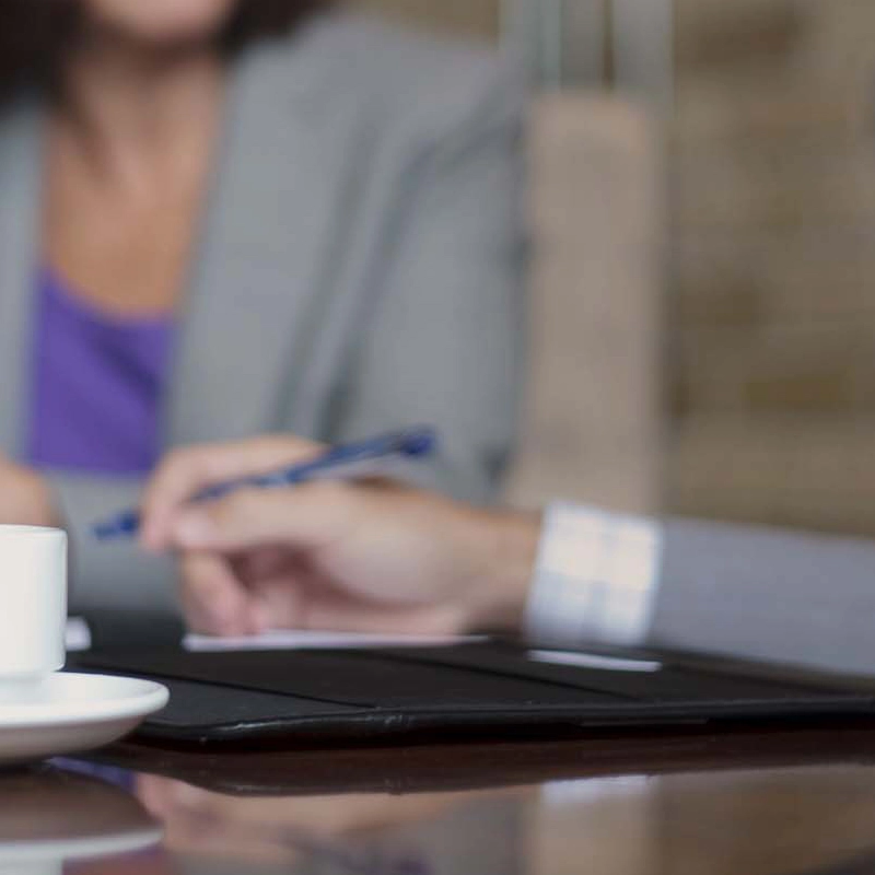 Two coworkers having coffee.